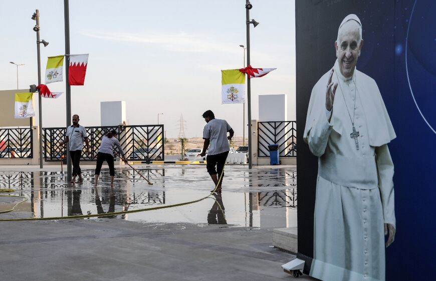 Workers clean up outside the cathedral of Our Lady of Arabia, near the Bahraini capital Manama, ahead of the pope's visit