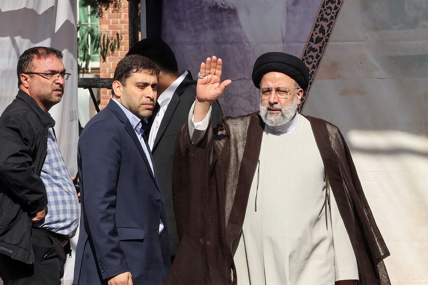 Iran's President Ebrahim Raisi waves as he arrives for a speech at a rally outside the former US embassy in the capital Tehran on November 4, 2022, to mark the 43th anniversary of the start of the Iran hostage crisis