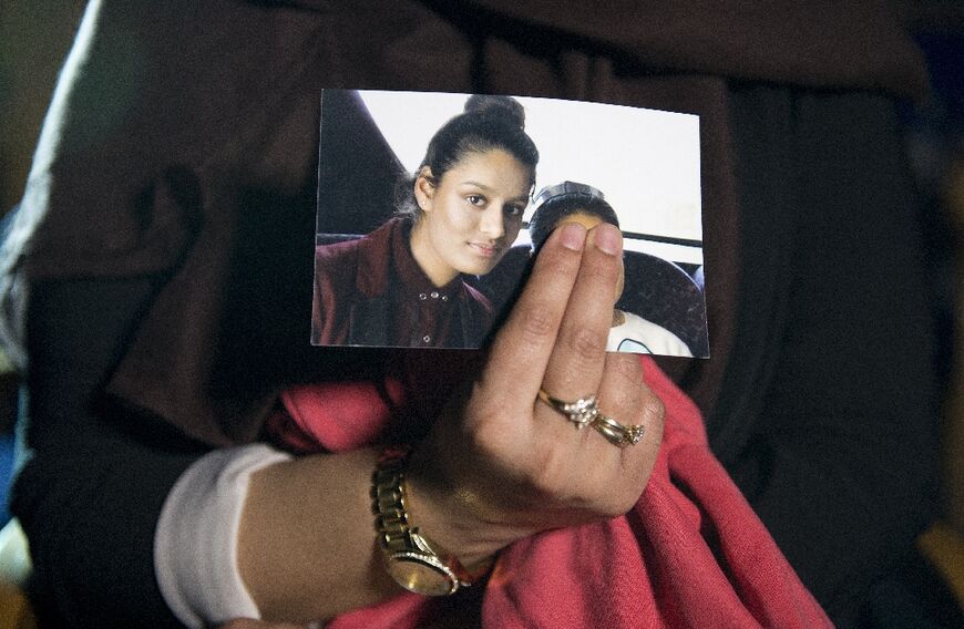 Begum's eldest sister Renu holds a photo of her as a teenager 