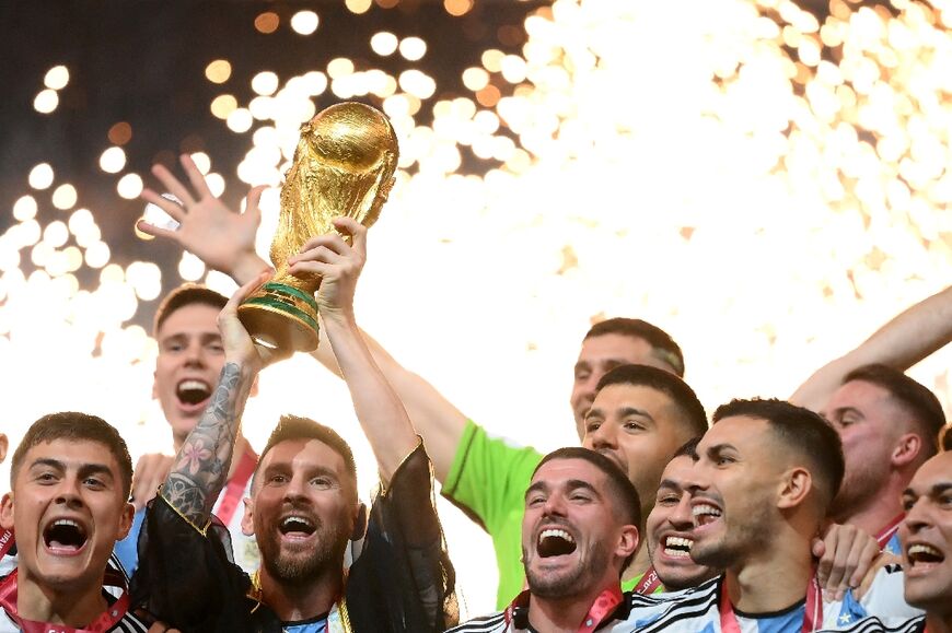 Argentina's Lionel Messi lifts the Qatar 2022 World Cup trophy after the final match against France which Argentina won in the penalty shoot-out