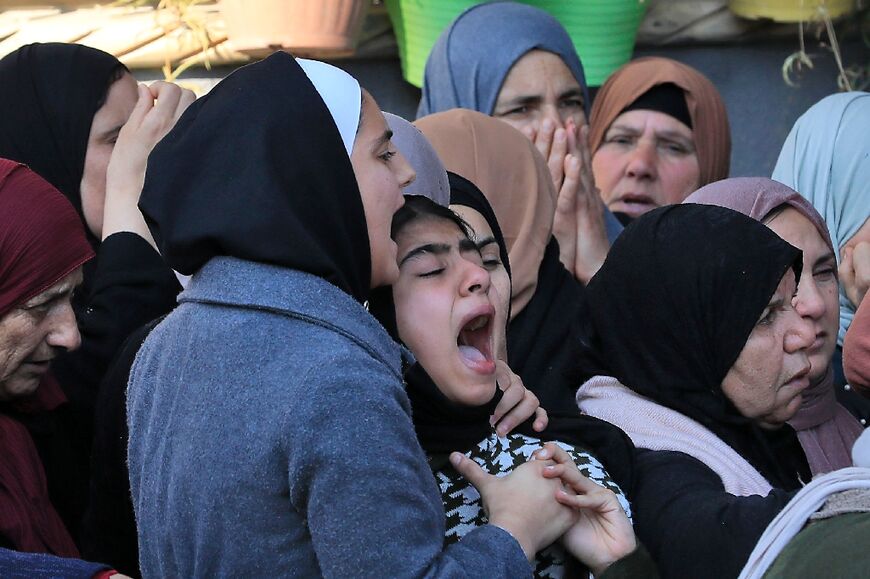 Palestinian relatives mourn during the funeral of Ahmed Atef Daraghmeh, 23, killed during clashes with Israeli forces on December 22 in the occupied West Bank: the new Israeli government has sparked fears of military escalation in the West Bank