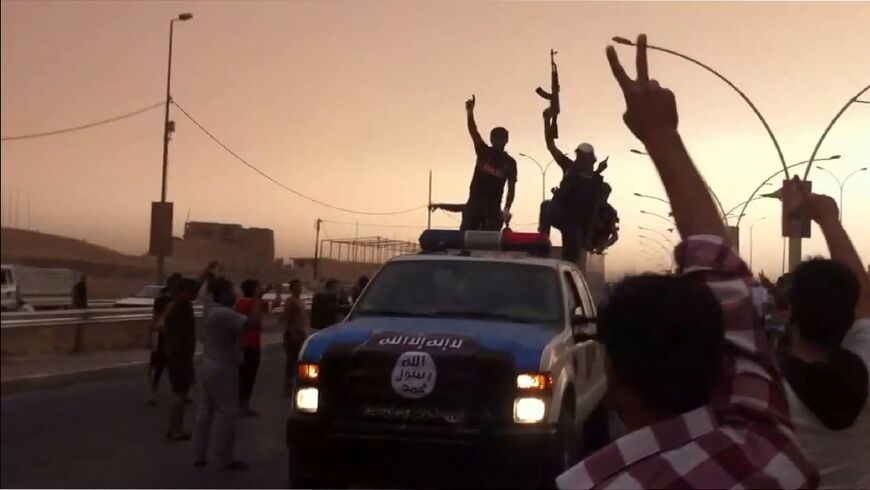 IS militants allegedly seen in Mosul, Iraq in an image from an online video uploaded on June 12, 2014