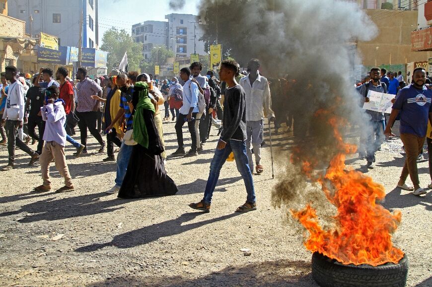 Protesters set fire to tyres in angry marches against the deal