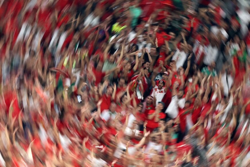 Morocco supporters cheer during the Qatar 2022 World Cup quarter-final football match against Portugal: three African teams -- Cameroon, Ghana and Senegal -- have made it to the quarter-finals since 1990, but Morocco is the first to reach the semis