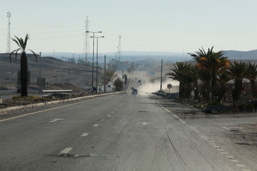 A main road in Maan is nearly deserted after a senior police officer was shot dead 