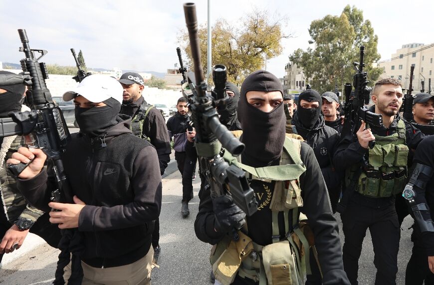 Palestinian gunmen at the funeral of Ahmed Adu Junaid, who was killed Wednesday during clashes with Israeli forces in the Balata refugee camp in Nablus