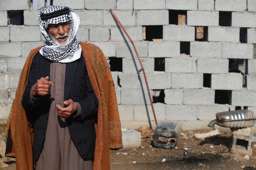 Jabbar Alwan at the scene of an attack by Islamic States group militants, which claimed the lives of four of his relatives, in the village of Albu Bali northeast of the Iraqi capital Baghdad