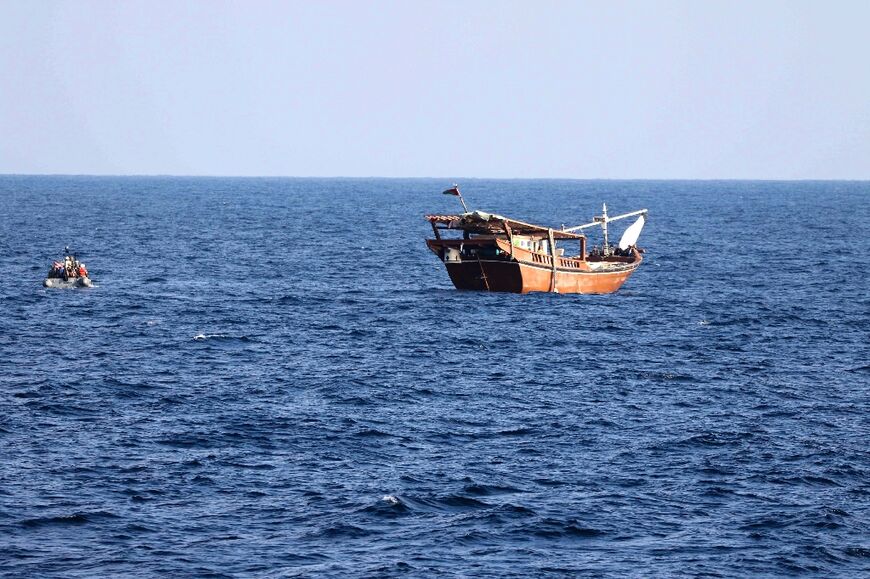 A US Navy photo shows a boarding team from the patrol coastal ship USS Chinook approaching the fishing vessel in international waters off Oman