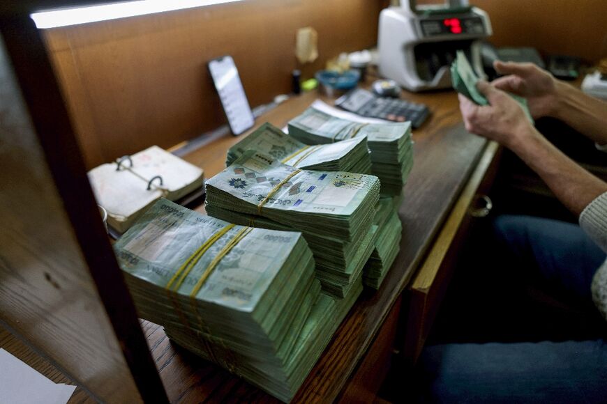 Lebanon's embattled local currency dropped to a new low Thursday against the US dollar 
