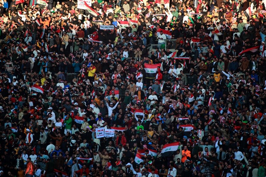 Iraq supporters take their seats ahead of the match