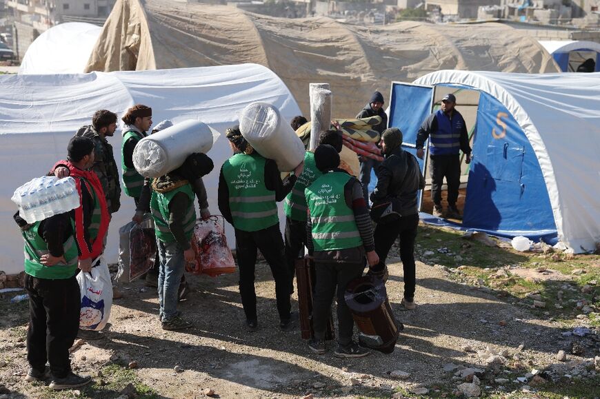 Syrians flock to a camp for the homeless in Harim in Syria's rebel-held northwestern Idlib province following the devastating earthquake 