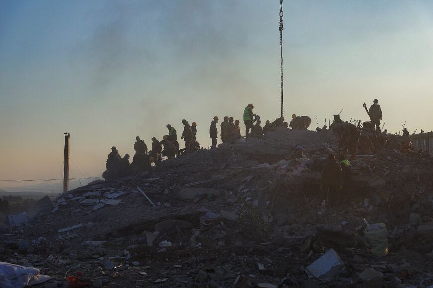 Rescuers search for survivors and victims amid destroyed buildings in Turkey's Nurdagi