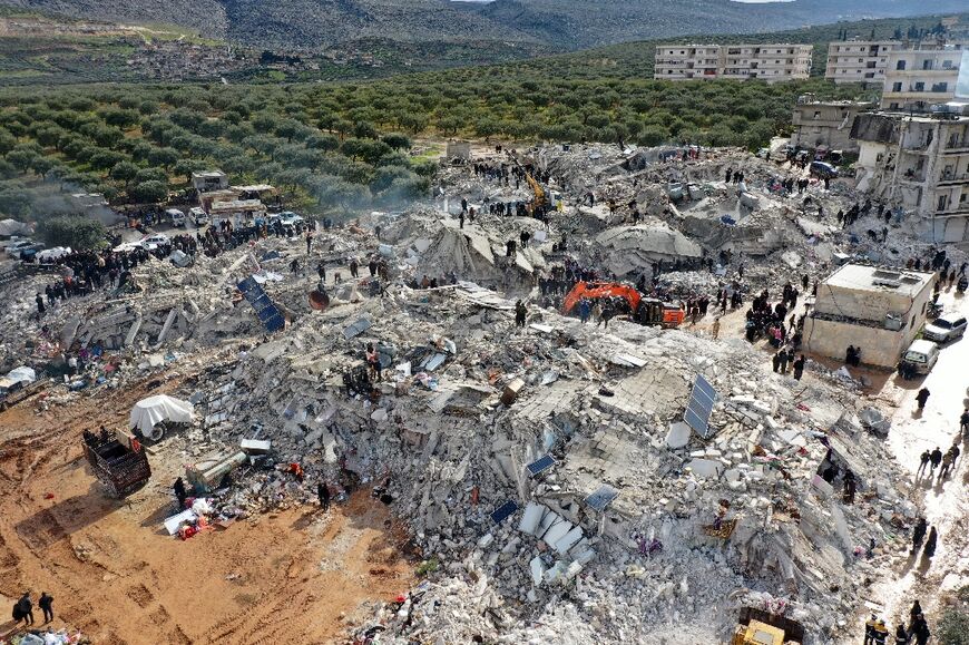 Rescuers search for  survivors in Syria after a poweful earthquake