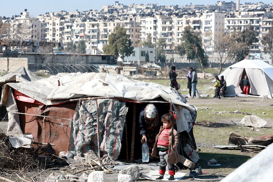 Syrians displaced by quake damage live at a makeshift camp in the Bustan al-Basha neighbourhood of the government-held northern city of Aleppo