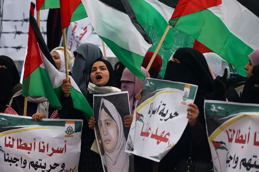 Protesters rally in solidarity with Palestinian prisoners held in Israeli jails, at the Erez crossing between Israel and the northern Gaza Strip on February 2, 2023 