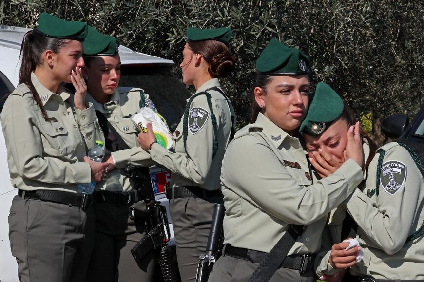 Israeli police mourn during the funeral of a fellow officer killed in a stabbing attack carried out by a Palestinian boy in annexed east Jerusalem, in the Bedouin town of Hussniyya in northern Israel on February 14, 2023