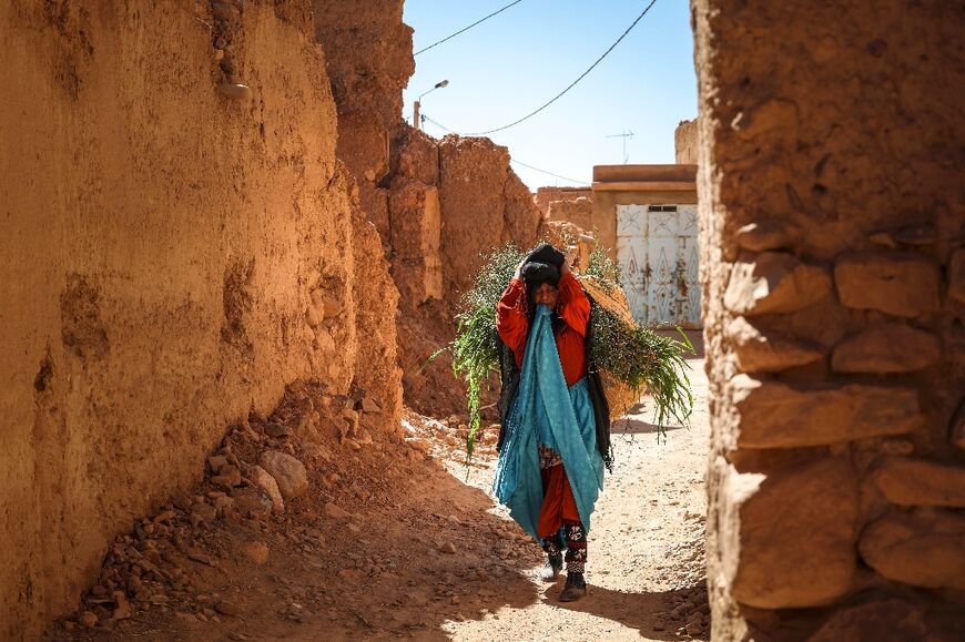 A woman walks in an alley in the former Jewish neighbourhood of Tagadirt: little documentation remains of the rich legacy that the community left behind