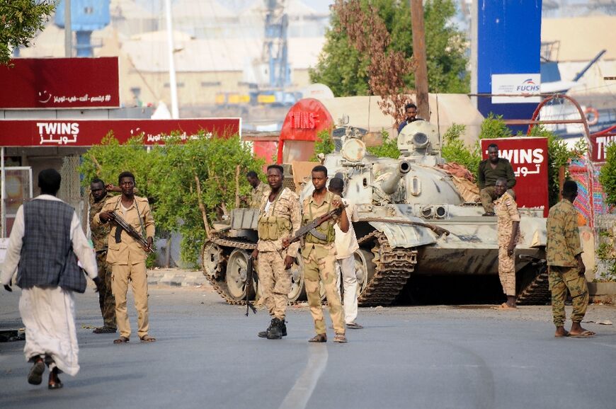 Sudanese army soldiers, loyal to army chief Abdel Fattah al-Burhan, man a position in the Red Sea city of Port Sudan