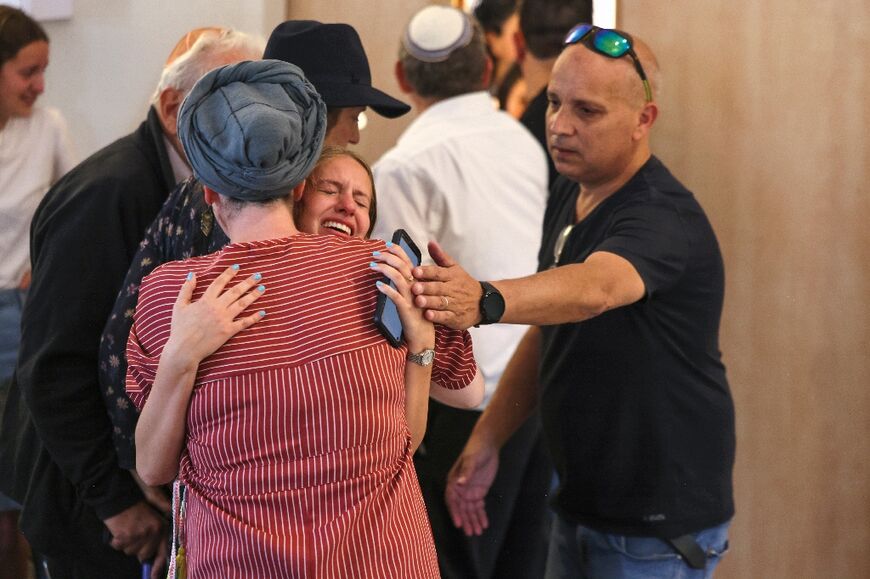 Mourners at the funeral of British-Israeli sisters Rina and Maya Dee at the Kfar Etzion settlement cemetery in the occupied West Bank, on April 9, 2023