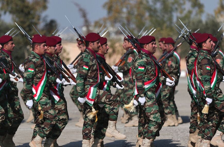 Iraqi-Kurdish Peshmerga officers take part in a graduation ceremony in Arbil, the capital of Iraq's northern autonomous Kurdish region, on January 15, 2023