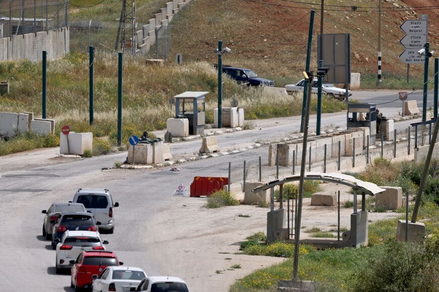 Motorists wait at Hamra junction in the occupied West Bank after the Israeli army closed it in its search for the perpetrators of a deadly shooting attack