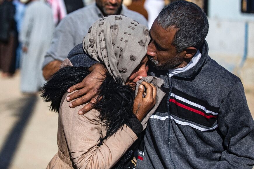 A man suspected of having collaborated with IS is greeted by a relative after being freed from the Kurdish-run Alaya prison in Qamishli