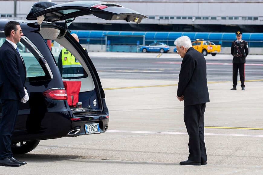 Italy's President Sergio Mattarella (Front R) pays respects to the returned body of Alessandro Parini, killed during a Tel Aviv car ramming, during a ceremony at Rome's Ciampino airport