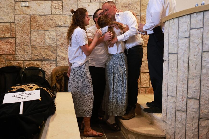 Mourners gathered at a settlement in the West Bank for the funeral of a British-Israeli woman killed in a shooting attack 