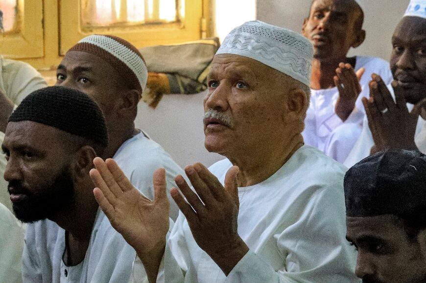 Muslim worshippers pray on the first day of Eid al-Fitr, which marks the end of Ramadan, at a mosque in Khartoum