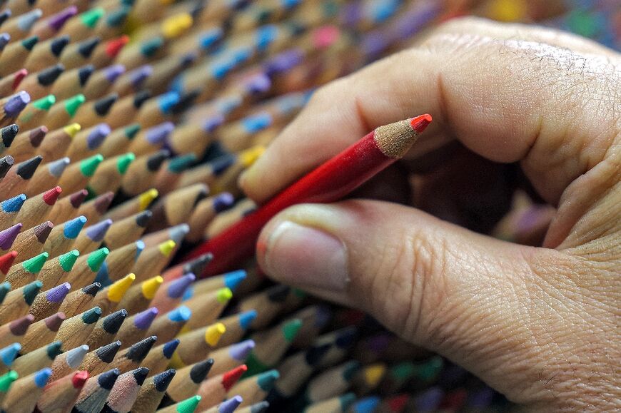 'I don't know how many pencils there are but I have about 200 colours available,' said the proud 50-year-old owner of the Medad Rafi (Rafi's pencils) shop