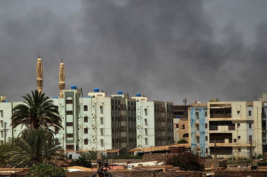 Smoke billows in Sudan's capital Khartoum on the fifth day of a US-Saudi brokered ceasefire