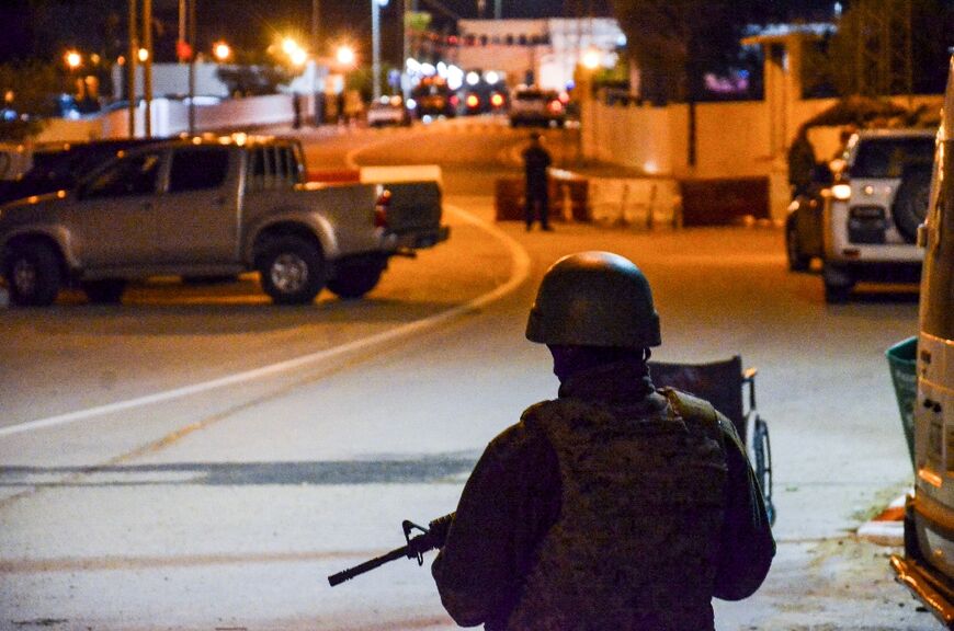 A Tunisian police officer shot dead four people at Africa's oldest synagogue in an attack Tuesday that sparked panic during an annual Jewish pilgrimage 