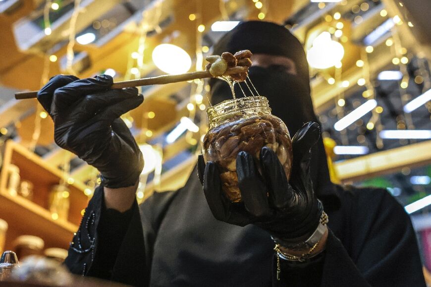 Palestinian beekeeper Miassar Khoudair, 29, started her business a few months ago after studying honey and herbal medicine in Saudi Arabia