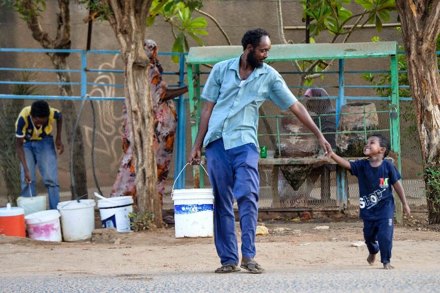 The truce has allowed some to venture out, including this man and boy in Omdurman