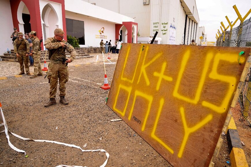 Foreign military personnel at Wadi Seidna Air Base, north of Khartoum in Sudan on April 30, 2023, as the last evacuees and military personnel prepare to leave, bound for Cyprus
