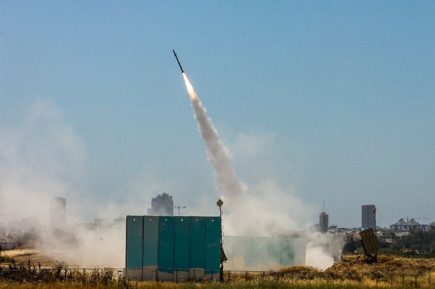 Israeli air defences respond as more than 60 rockets are fired from Gaza towards Israeli population centres, including Tel Aviv