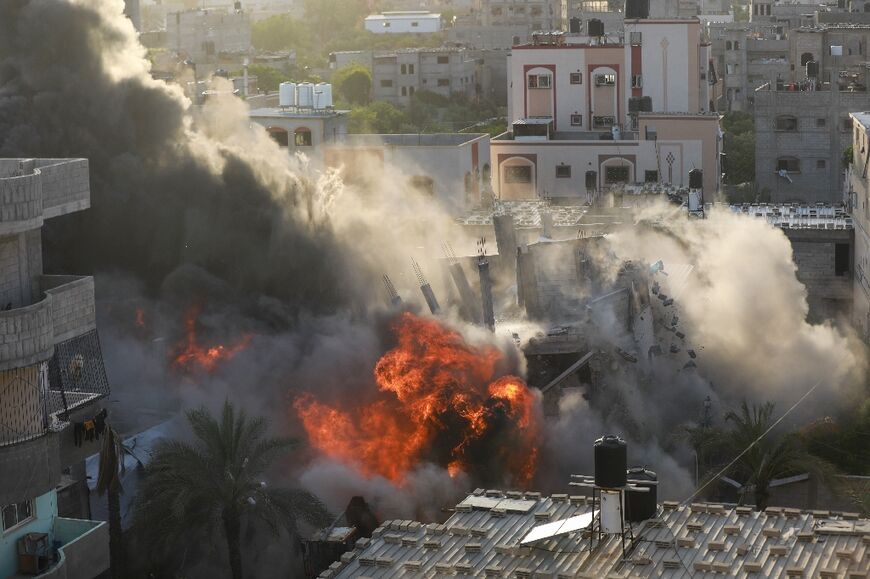 An Israeli air strike flattens a house in Gaza City