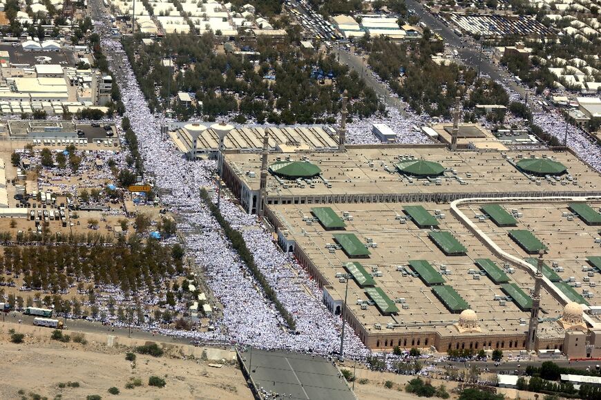 Pilgrims pack a road near Namirah mosque close to Mount Arafat