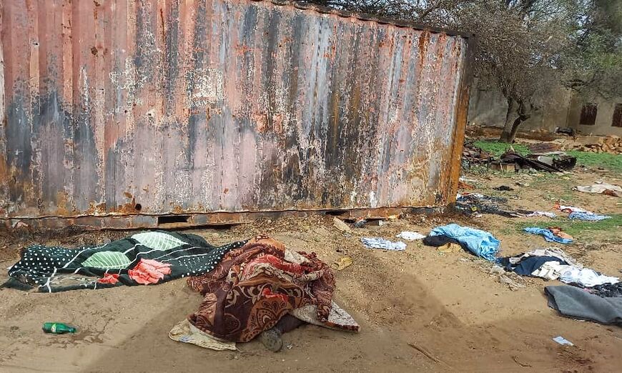 Covered bodies lie near houses in El Geneina, West Darfur -- residents, the UN and others say civilians have been targeted and killed in Darfur for their ethnicity by the RSF and allied Arab militias