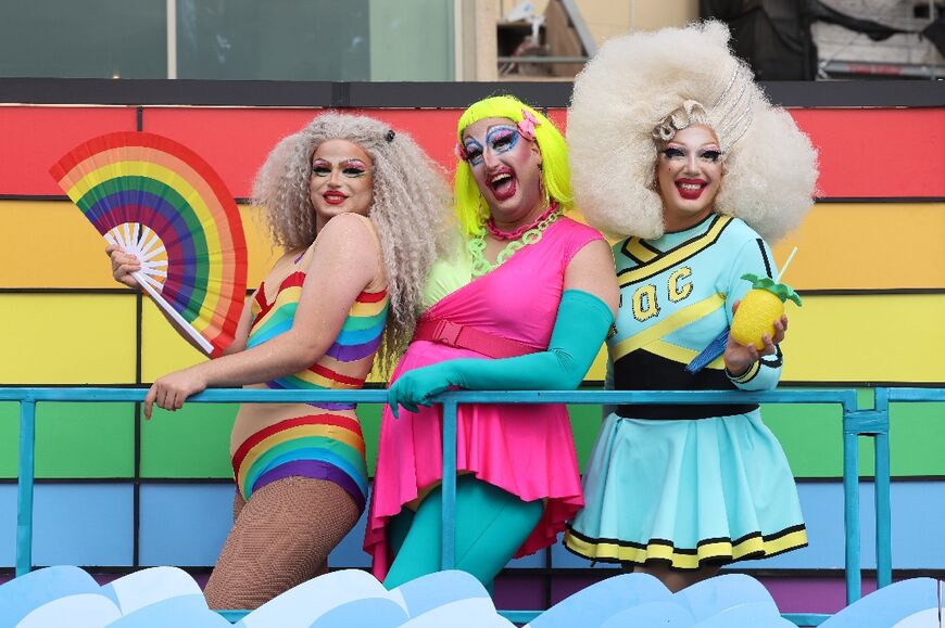 Revellers in colourful outfits danced on and around floats playing music on Tel Aviv's seafront promenade