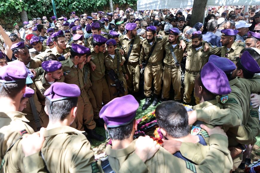 Israeli soldiers attend the funeral of a fellow soldier, killed in a shooting attack near Nablus