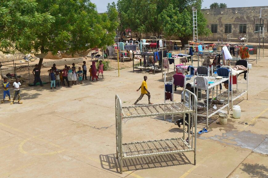 Some of the more than 2.2 million people internally displaced by Sudan's war are staying at a university, turned into a makeshift shelter, in al-Hasaheisa south of Khartoum