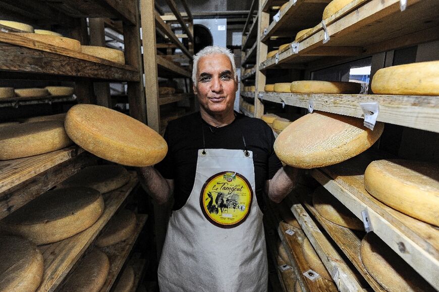 Aided by five employees, Ibersiene spends his days inspecting the cellars where the wheels of cheese are stored