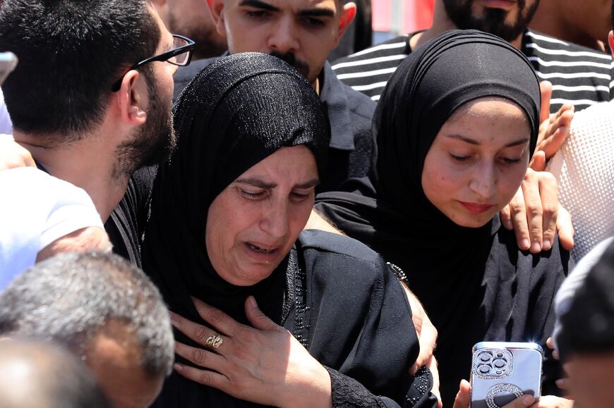 Mourners attend the funeral of Khairi Shaheen and Hamza Maqbul, killed by Israeli forces in Nablus