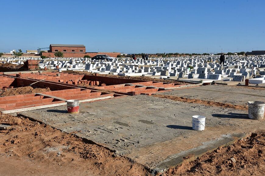 Graves are prepared for the bodies of migrants who drowned at sea and were recovered by the Tunisian coast guard, at the Barkallah cemetery in Sfax, on April 28, 2023 