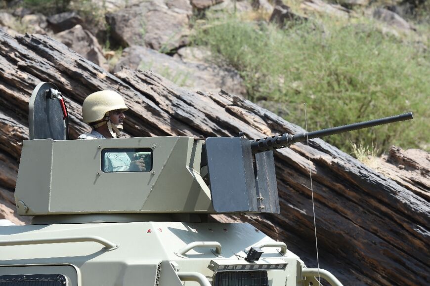 Saudi border guards keep watch along the frontier with Yemen in the al-Khobh area of Jizan province on October 3, 2017