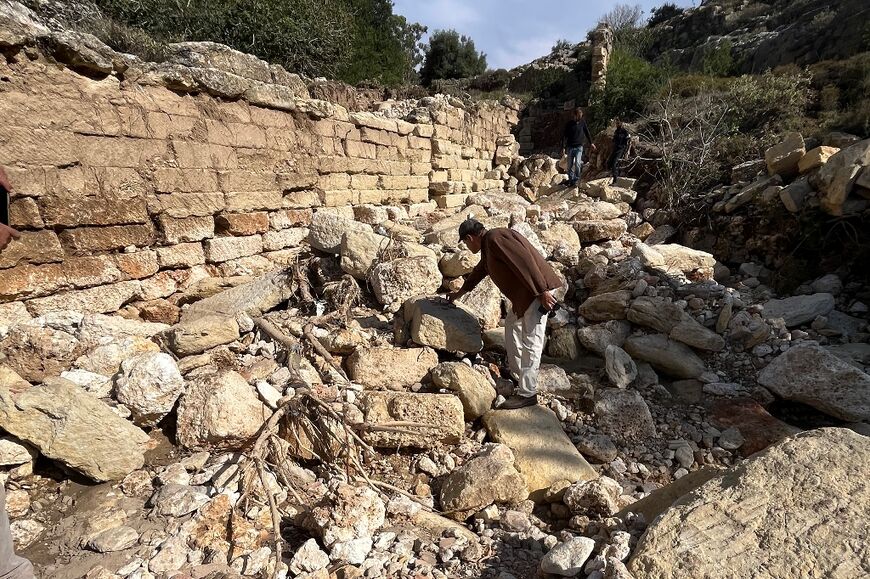 Fallen boulders block the main street connecting the upper and lowers levels of the ancient city down which rainwater would normally drain off