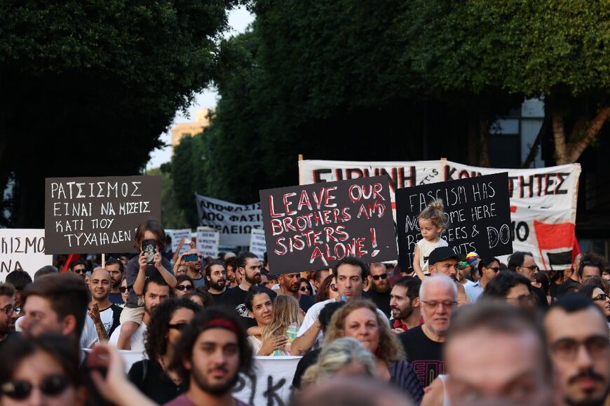 Activists march in solidarity with migrants in the Cypriot capital Nicosia following a string of attacks