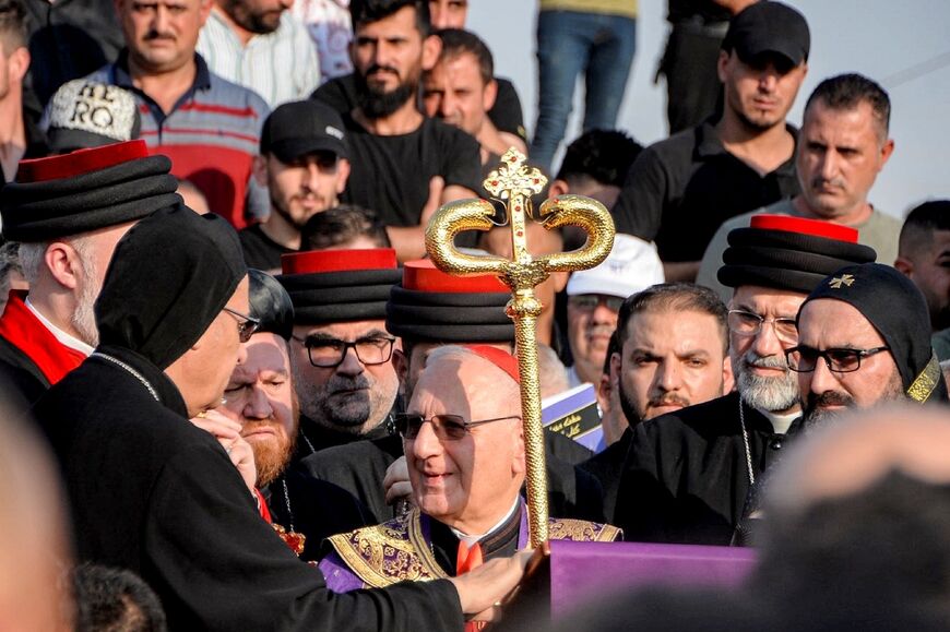 Cardinal Louis Sako leads a mass during the funeral