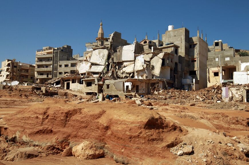 Rescuers sifted through mud and rubble in their search for people missing from the tsunami-sized flash flood that swept the Libyan port city of Derna